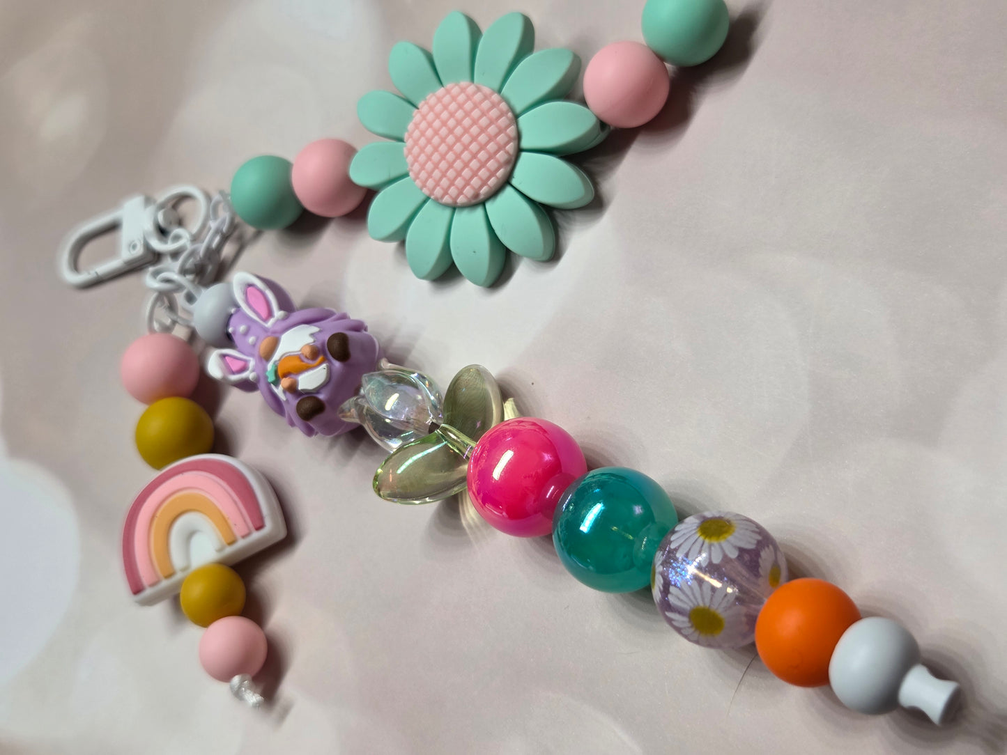Easter - 3 Strand Keychain/Purse Charm - Easter Gnome Holding a Carrot & Sitting on a Tulip, Large Pastel Green Flower, & Cute Little Rainbow