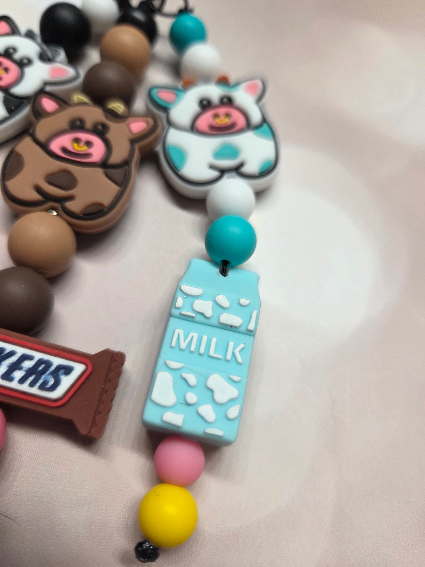 Cute Cow Keychain/Purse Charm. Each Cow has its own job! B&W-Eat Mor Chiken (works for that Chicken Restaurant)/Brownie-Chocolate Snickers Bar Maker/W&B- Milk Maker