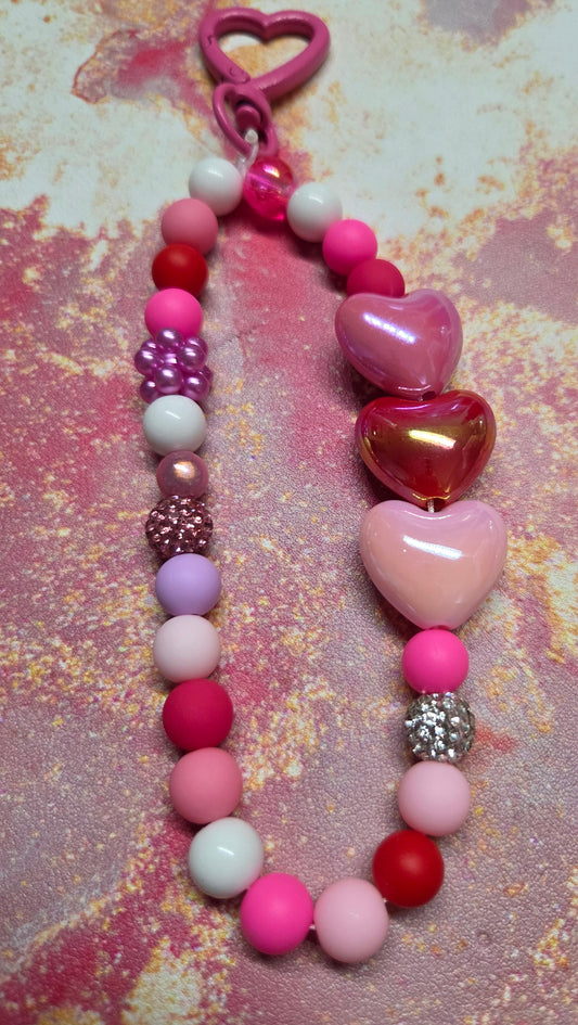 A Pocket Full of Hearts 💕- Phone Charm- if you love pinks, reds, rhinestones, & hearts, this is the one for you! Carabiner Topper