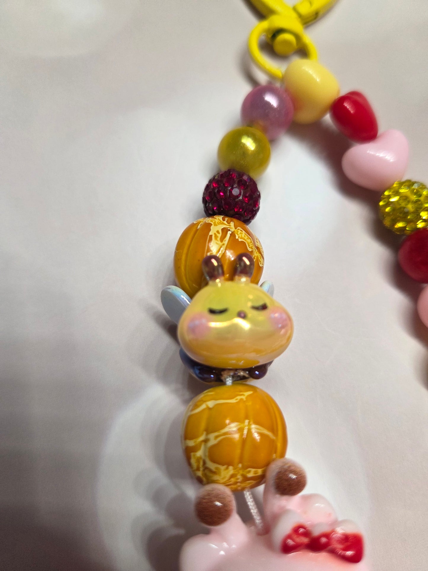 Phone Charm - HK in her adorable Bumblebee Costume while a little Bee follows her around with her honey beads!