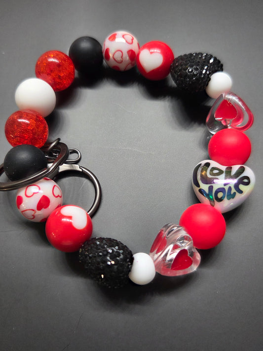 Valentine's Day - Wristlet - This one is very unique feat black, white, & Red Beads with Hearts and Rhinestones. If you like alt. Valentine's Day colors, this is for you! Black Hardware
