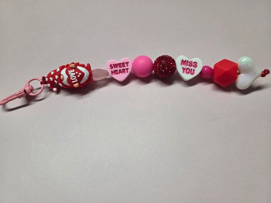 Valentine's Day Keychain/Purse Charm - Sweet Little Gnome Holding a Heart stating "Love" Wearing a Red Hat Covered in White Hearts feat Candy Phrase Heart Beads as Accent - Adorable!