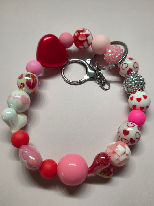 Valentine's Day - Wristlet feat all Different Types of hearts in a variety of colors with a heart stating "I Love You" - Truly beautiful! Silver Hardware